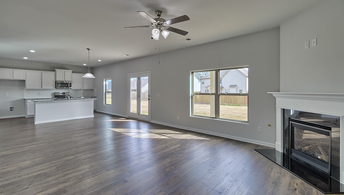 Living room with large windows and fireplace