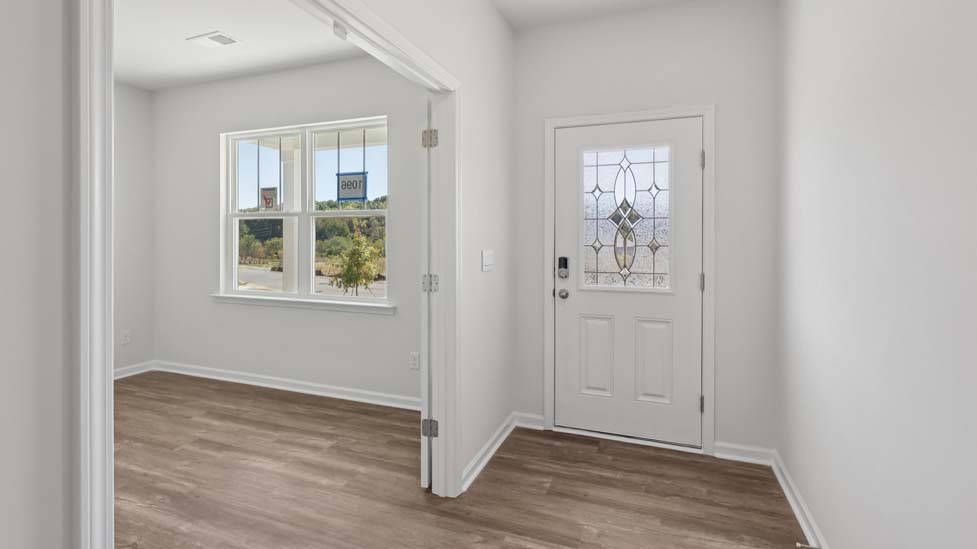 Welcoming foyer with view of flex space