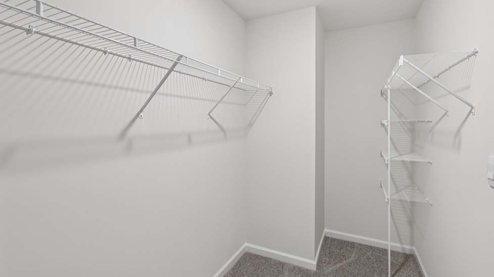 Walk in closet with shelving