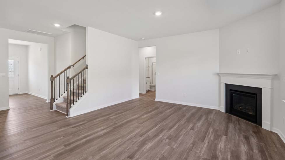 Open living area with electric fireplace