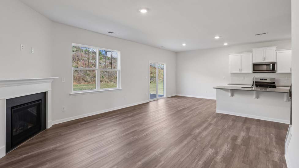 Open living area with electric fireplace
