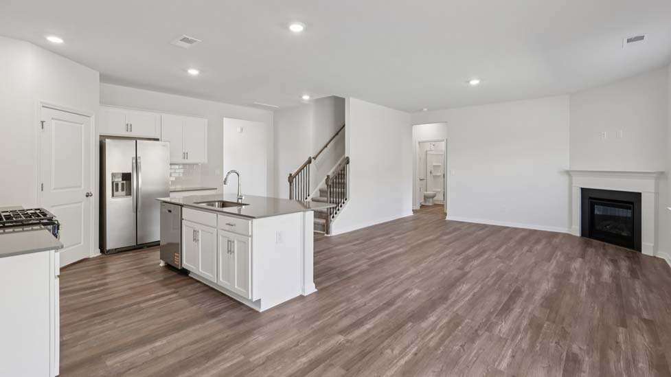 Open living area with electric fireplace