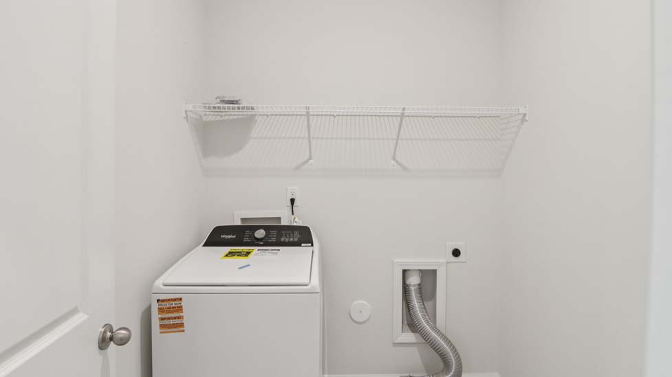 Laundry room with shelving