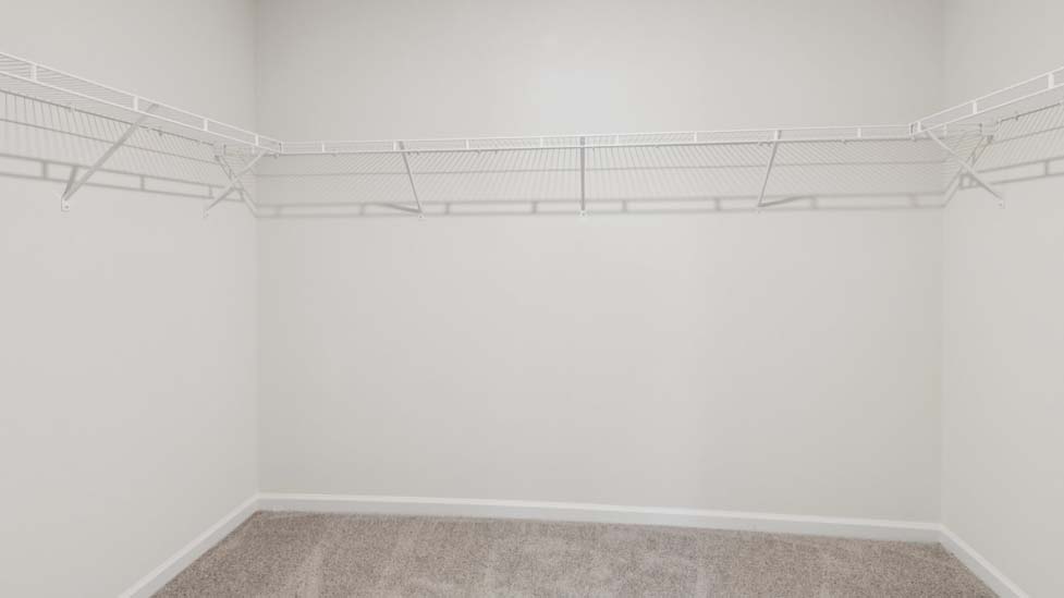 Walk in closet with shelving