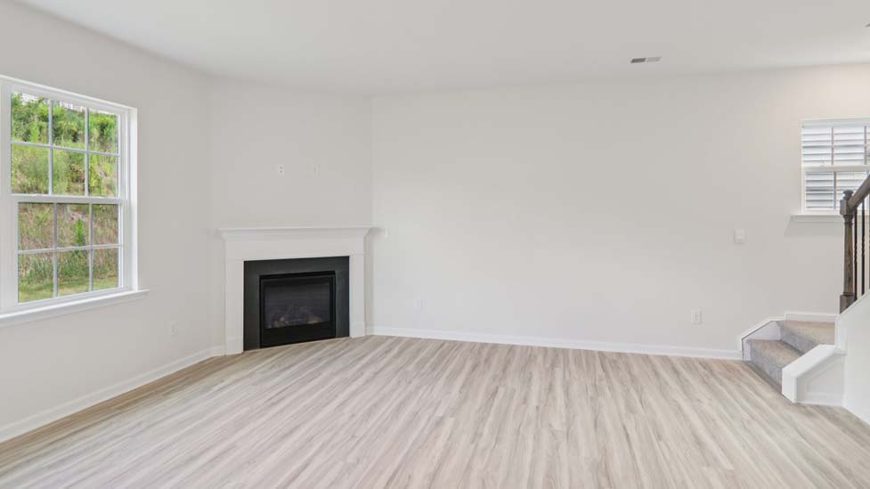 Open concept living area with electric fireplace