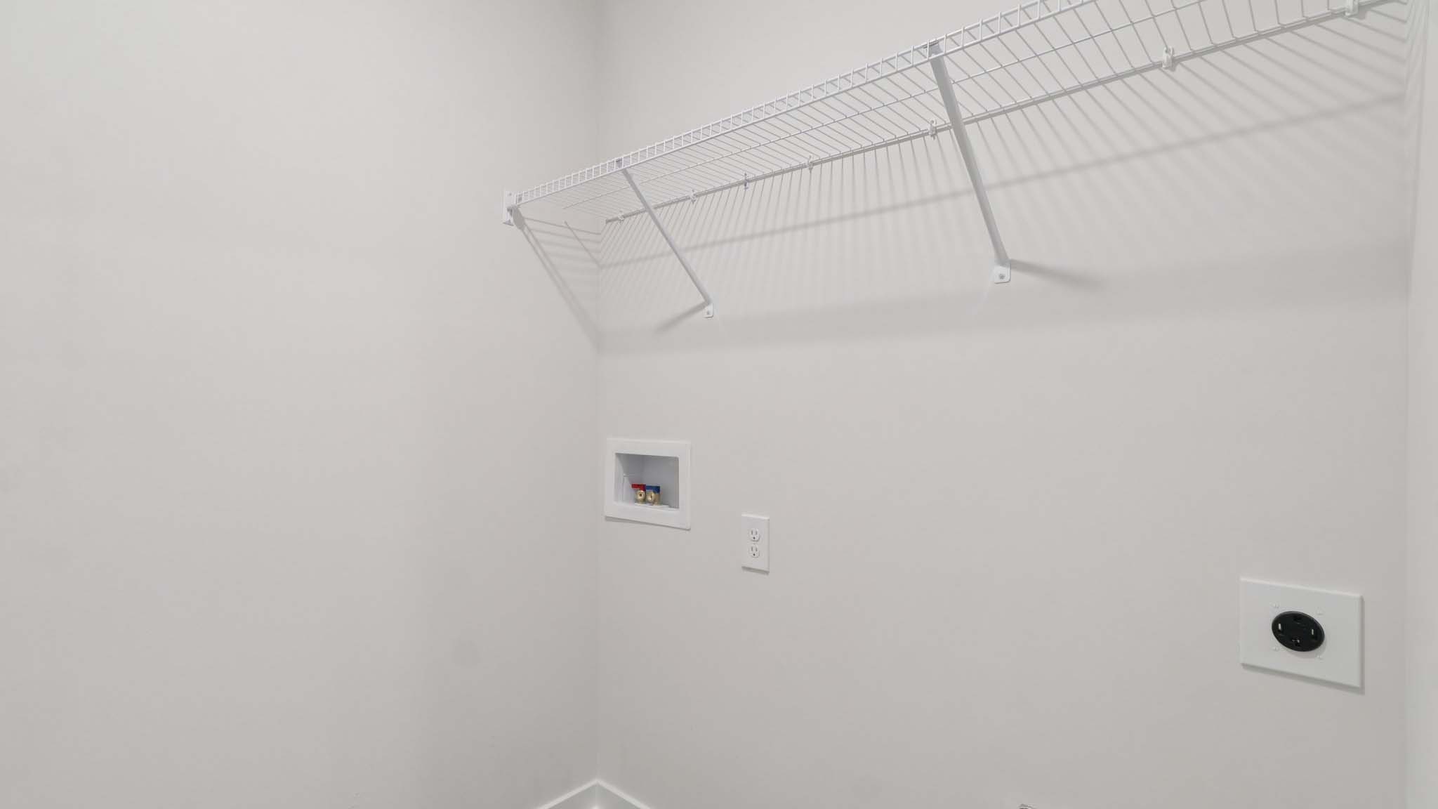 Laundry room with shelving