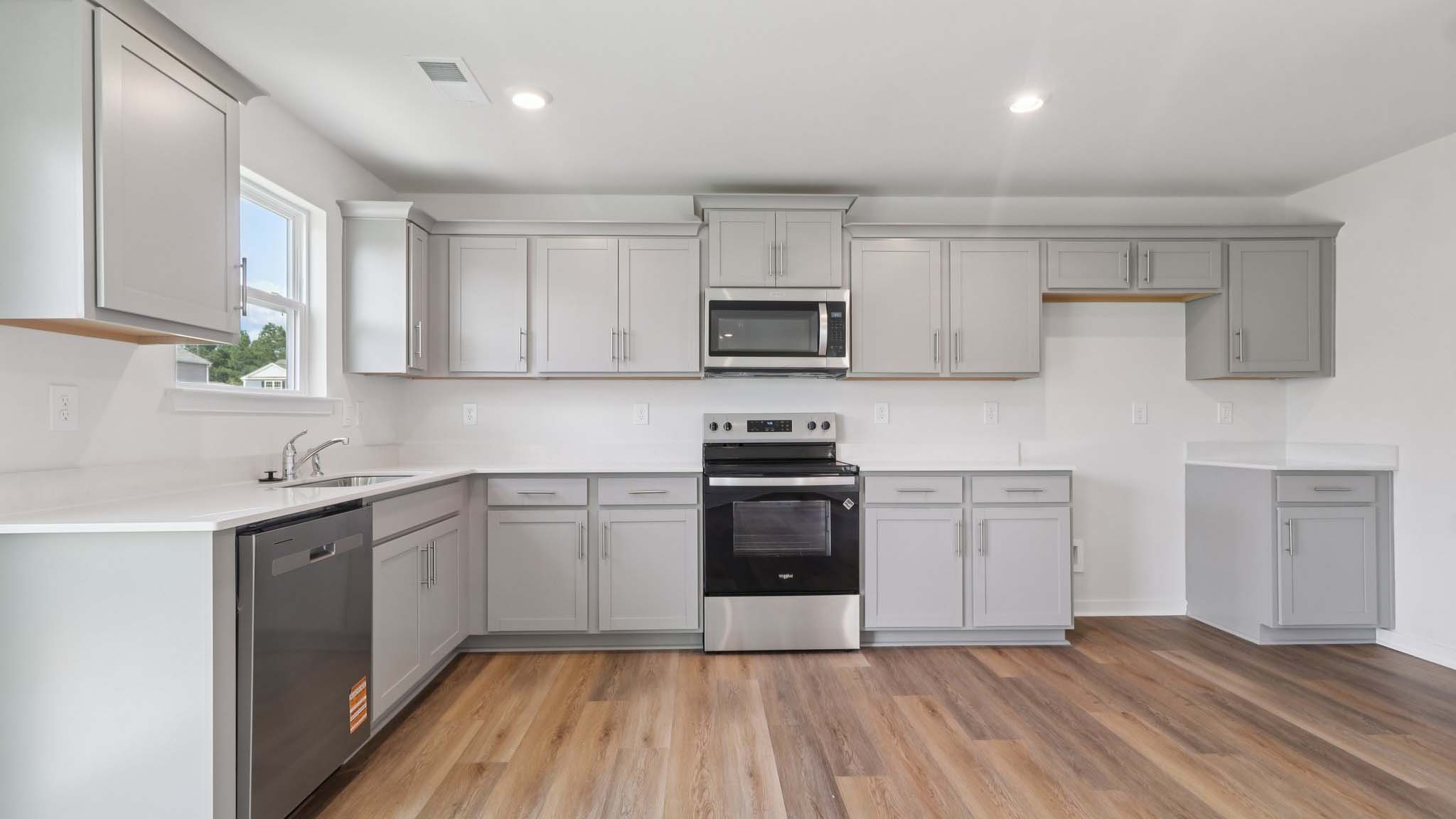 Open concept kitchen with stainless steel appliances