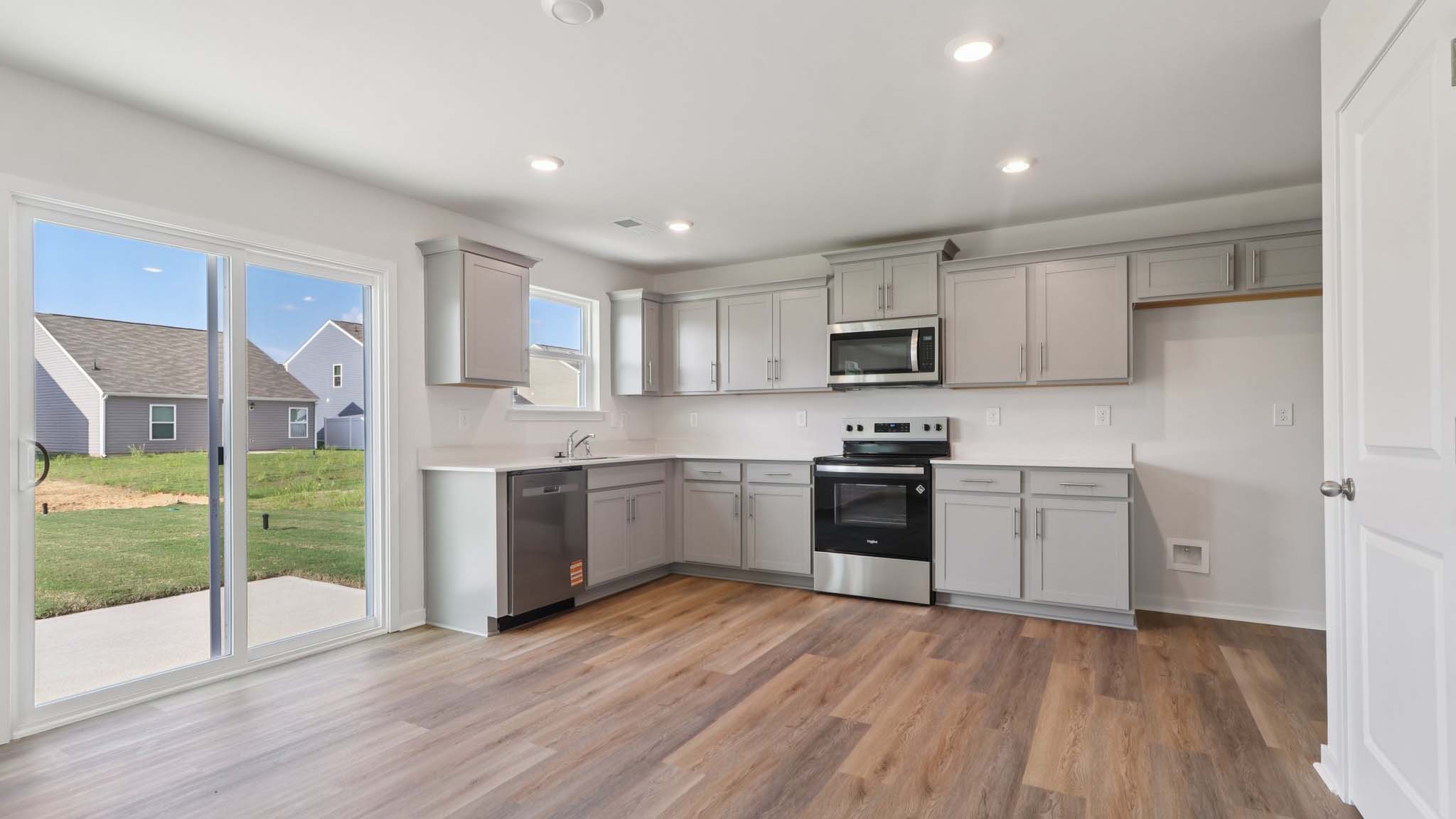 Open concept kitchen with stainless steel appliances