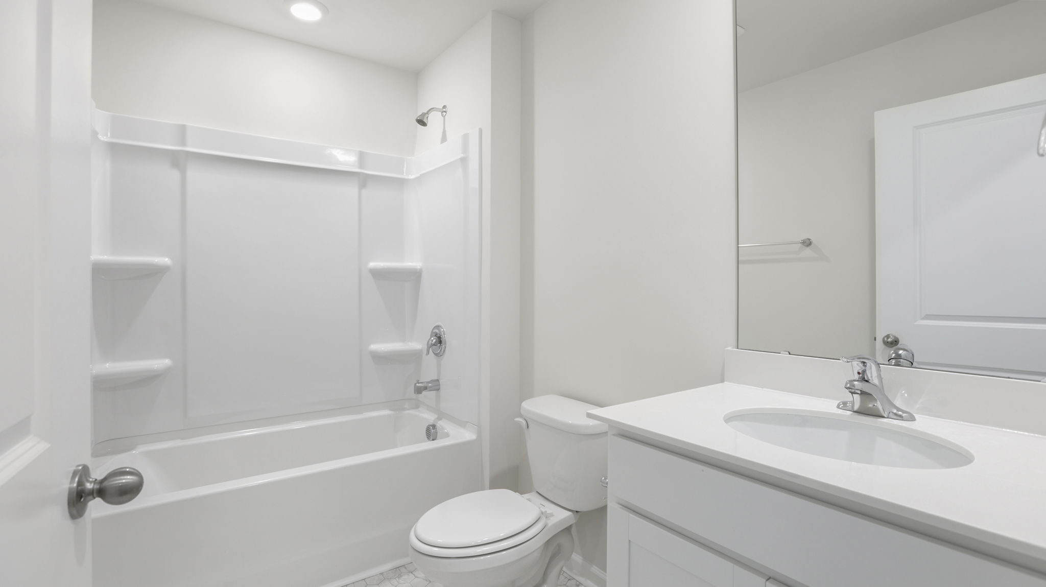 Bathroom with vanity and bathtub