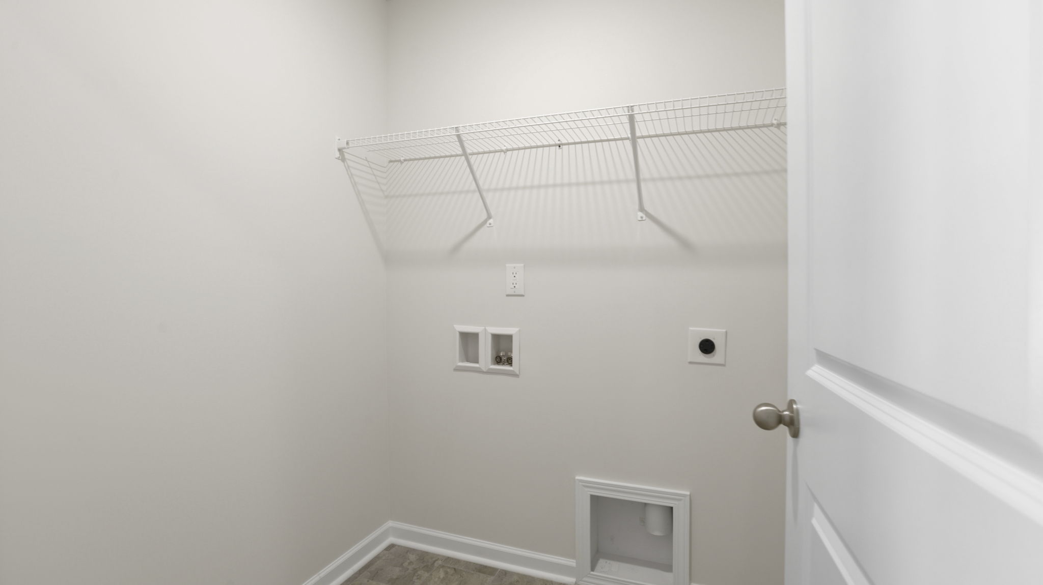 Laundry room with shelving