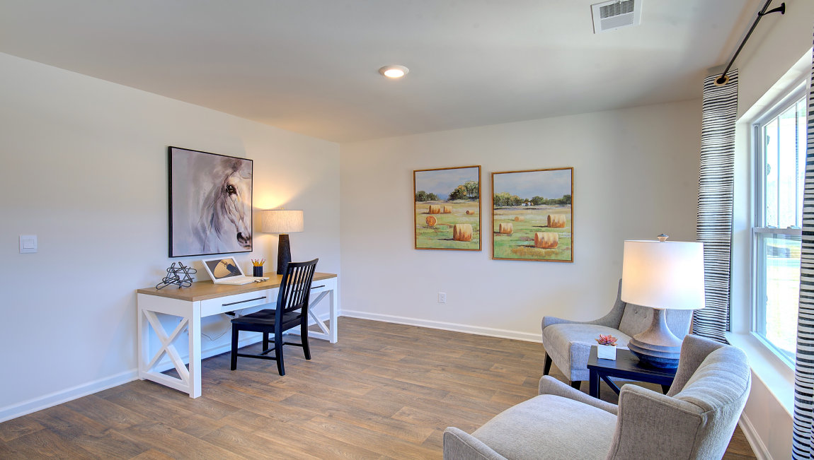 Front flex room with large windows