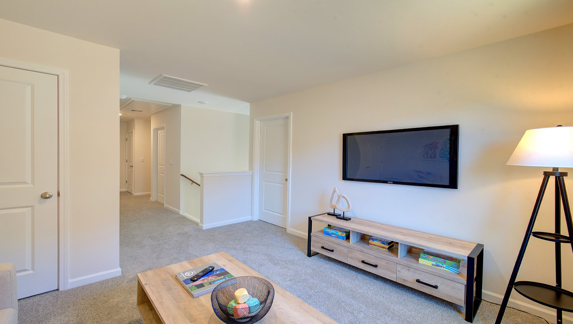 Large carpeted loft with large window