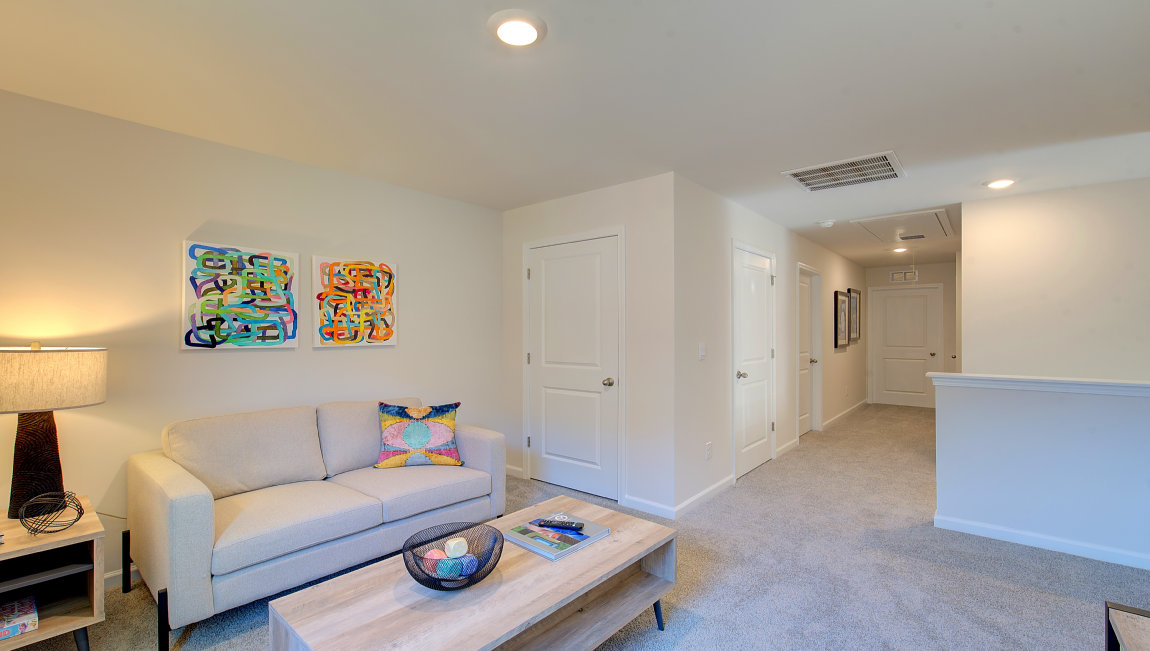 Large carpeted loft with large window