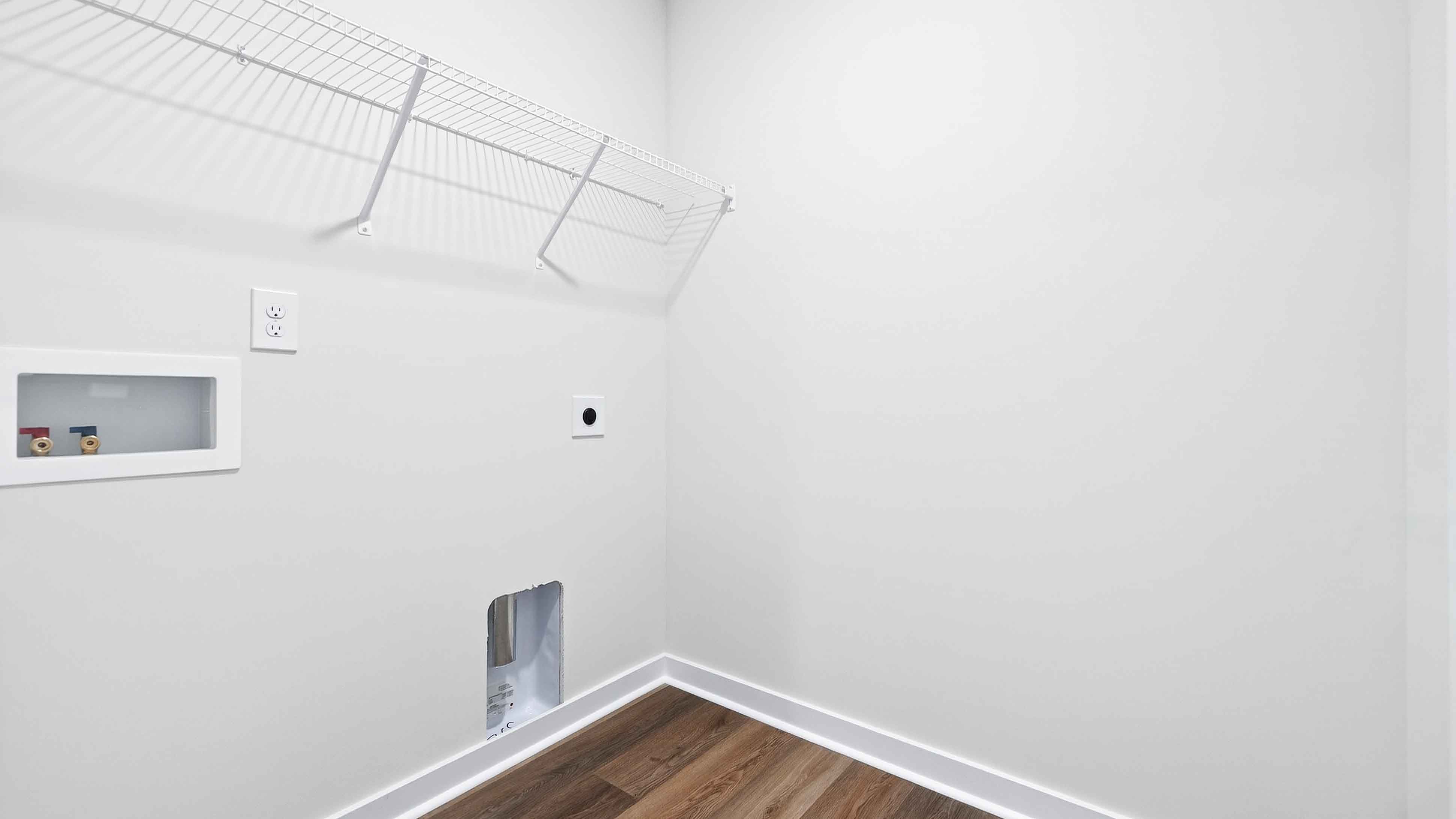 Laundry room with shelving