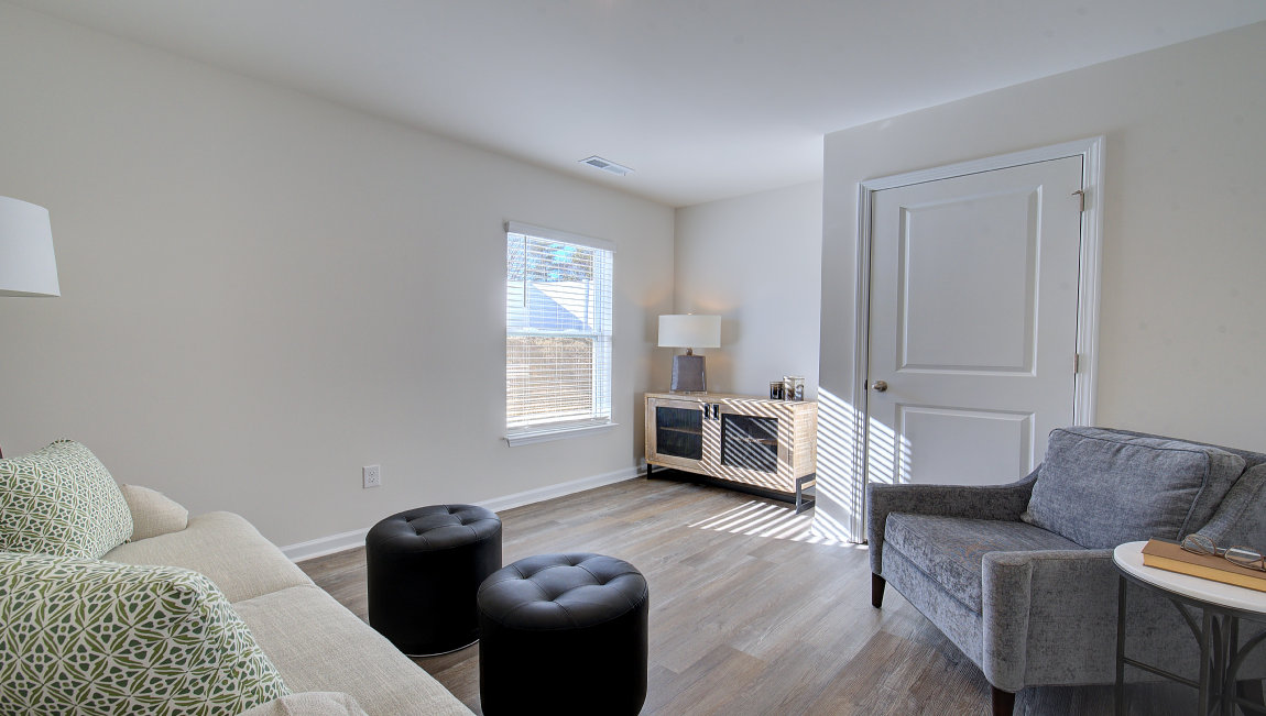 Downstairs bedroom with large window and closet