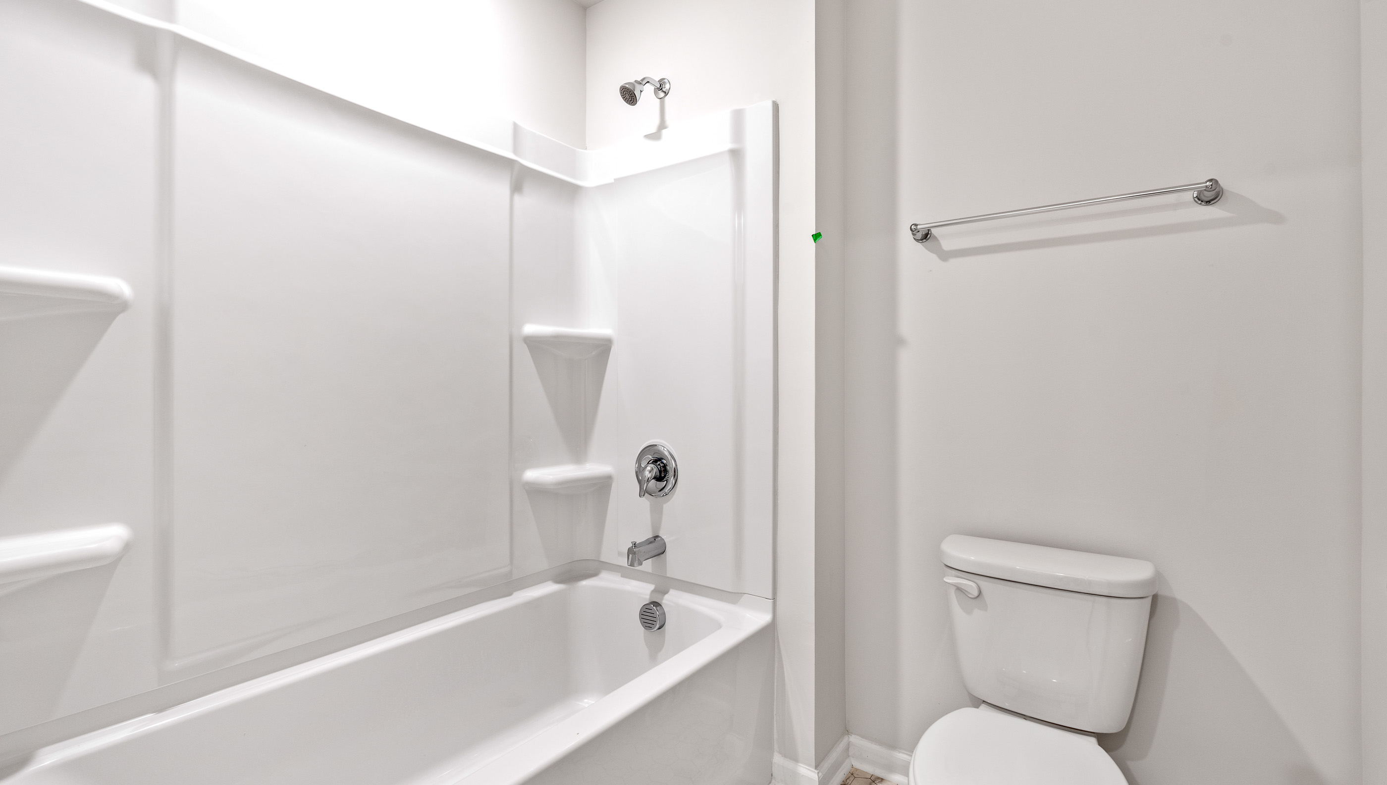 Bathroom with dual vanity and bathtub
