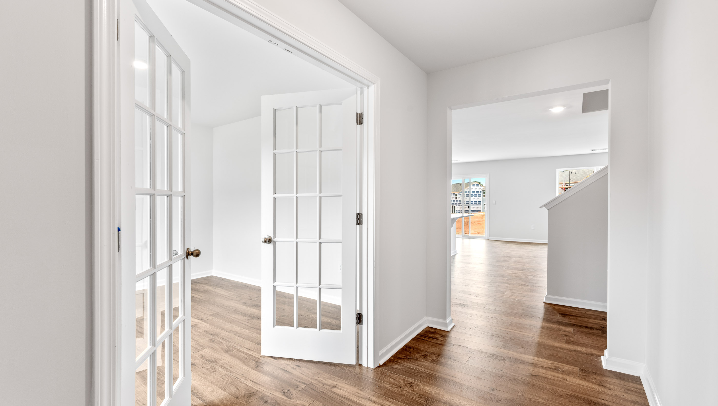 Front study with large window and glass doors