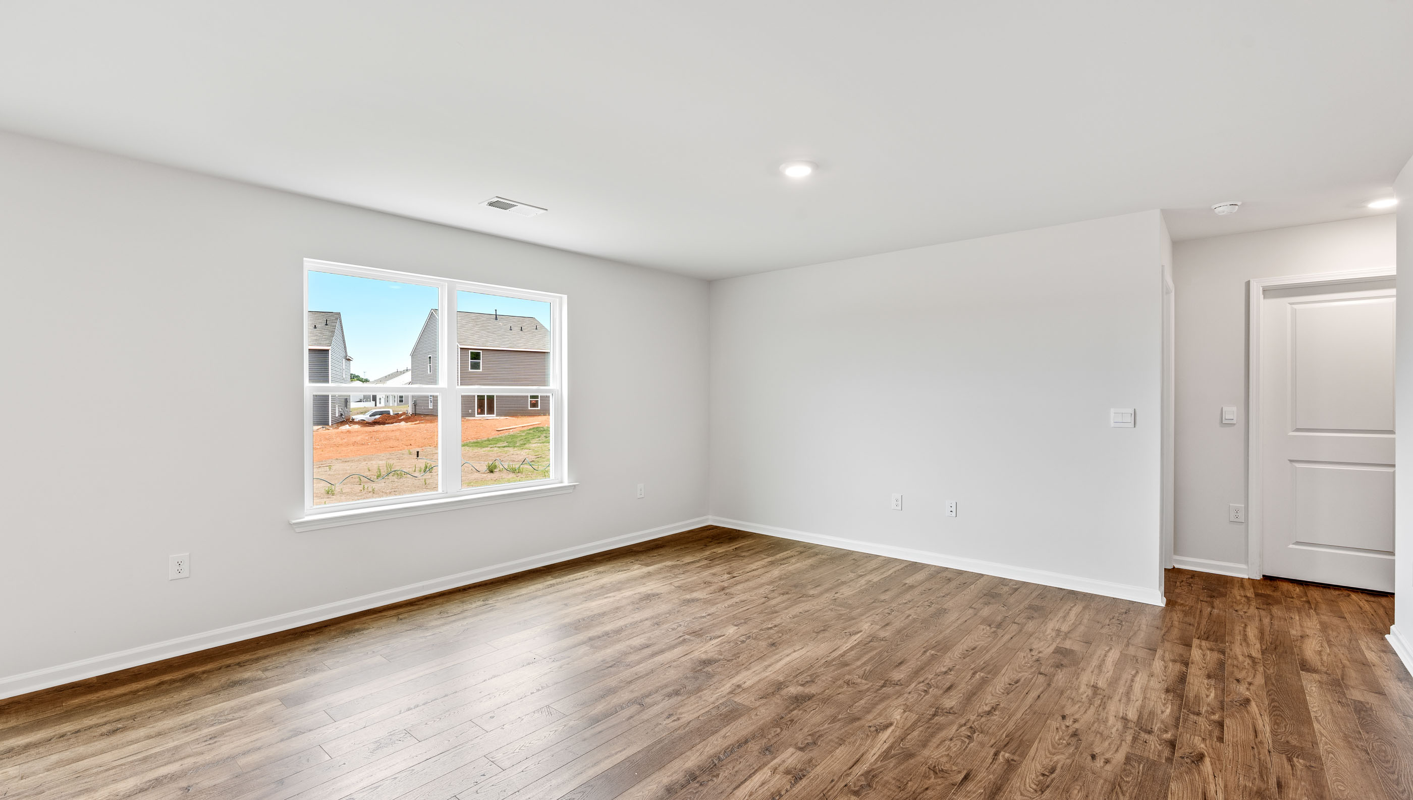 Open concept living area with large windows