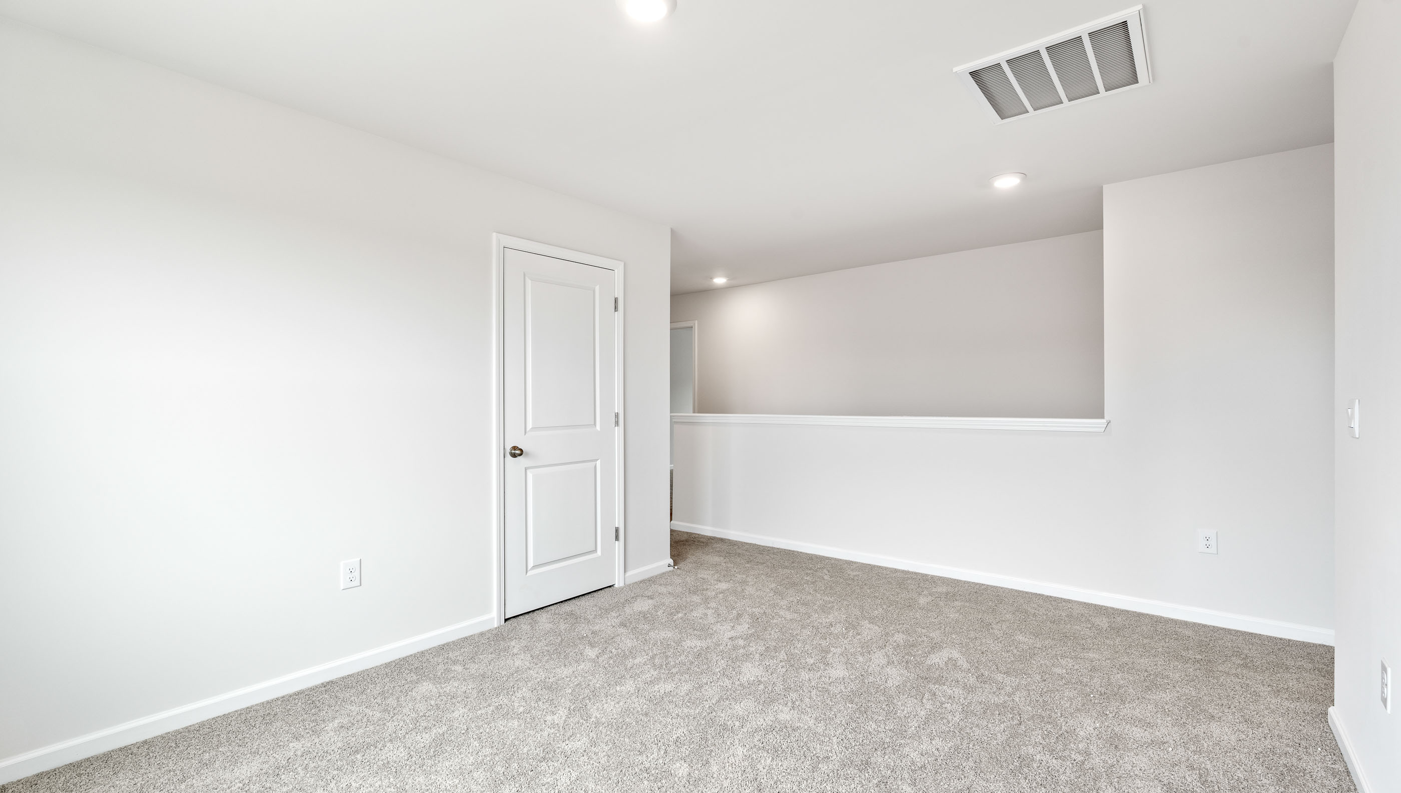 Carpeted upstairs living room area