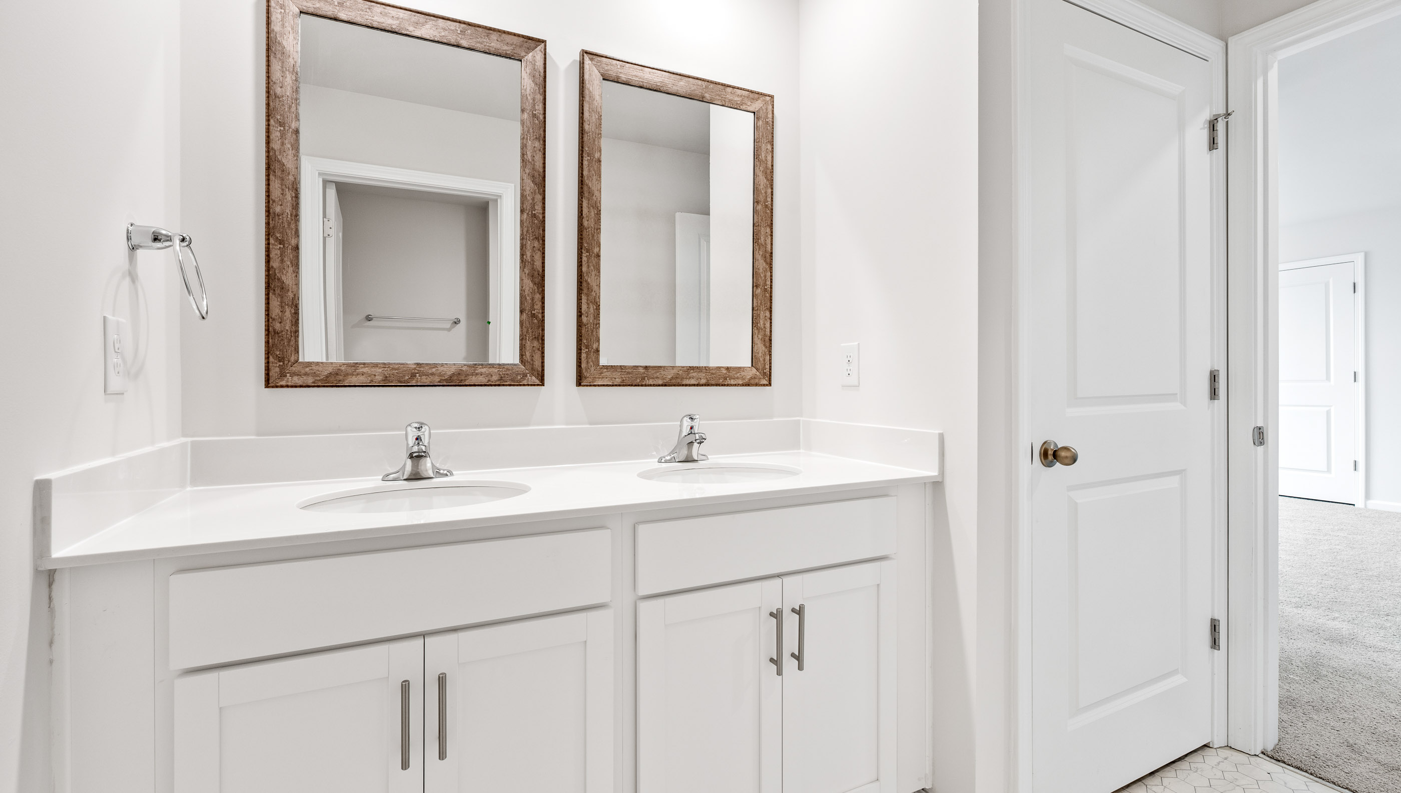 Bathroom with dual vanity and bathtub