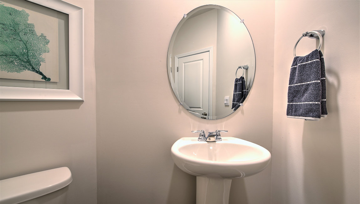 Powder bathroom with toilet and small sink