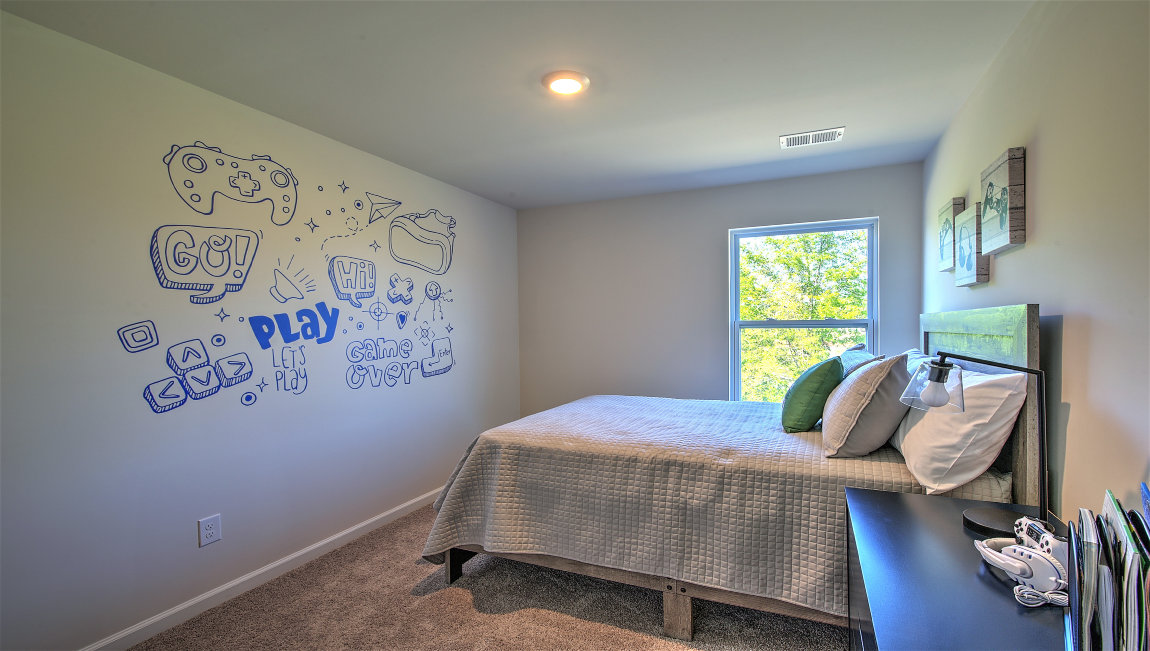 Carpeted bedroom with small window