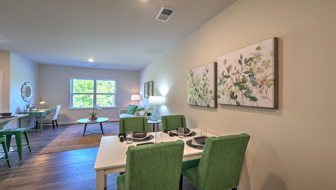 Family room with large window, beside kitchen