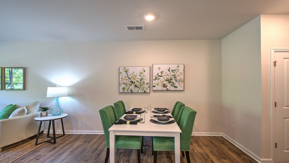 Family room with large window, beside kitchen