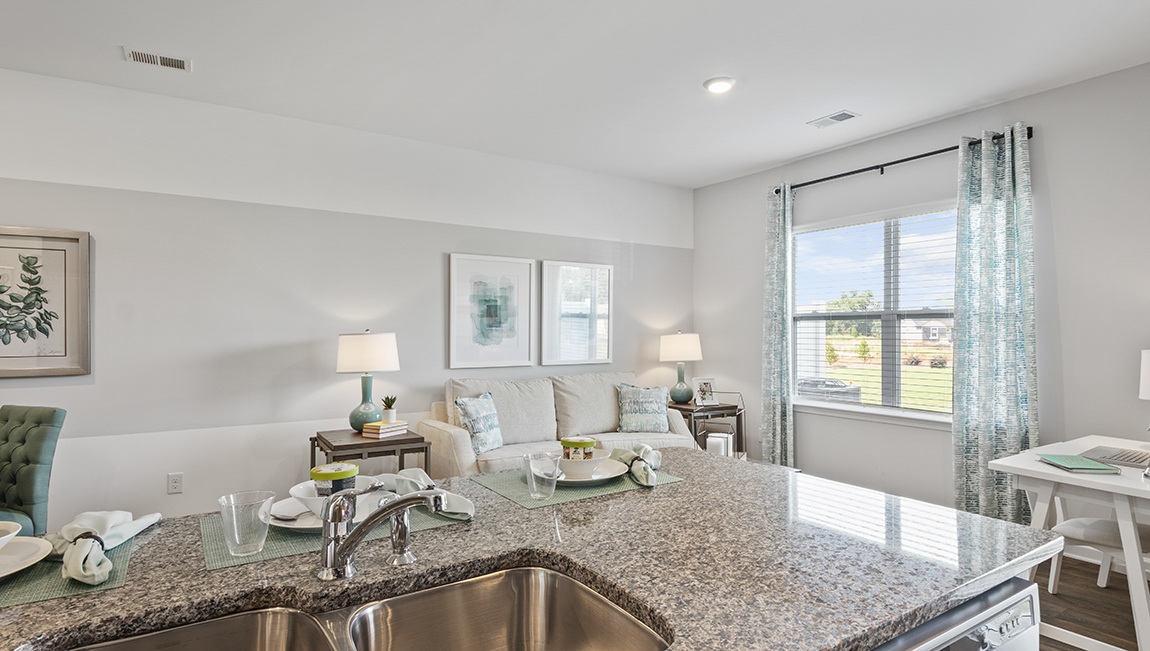 Open kitchen with island and stainless steel appliances