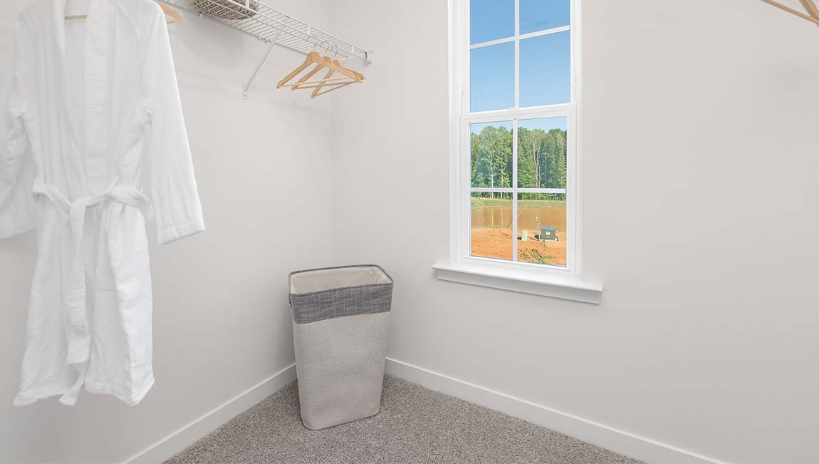 Primary walk in closet with window