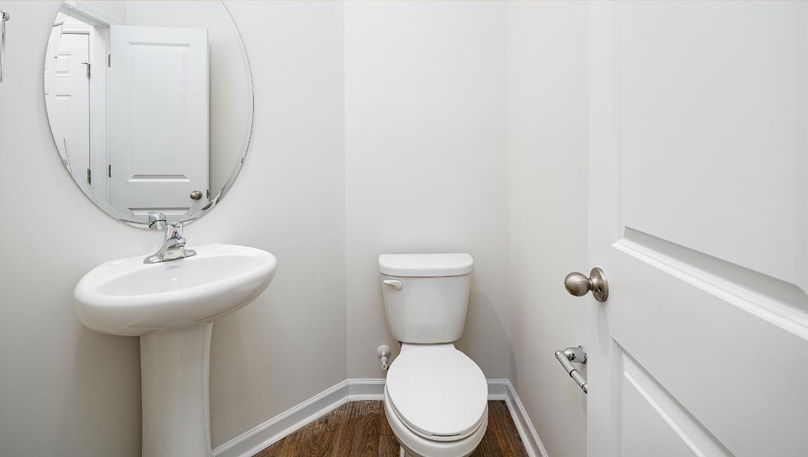 Half bathroom with single sink and mirror