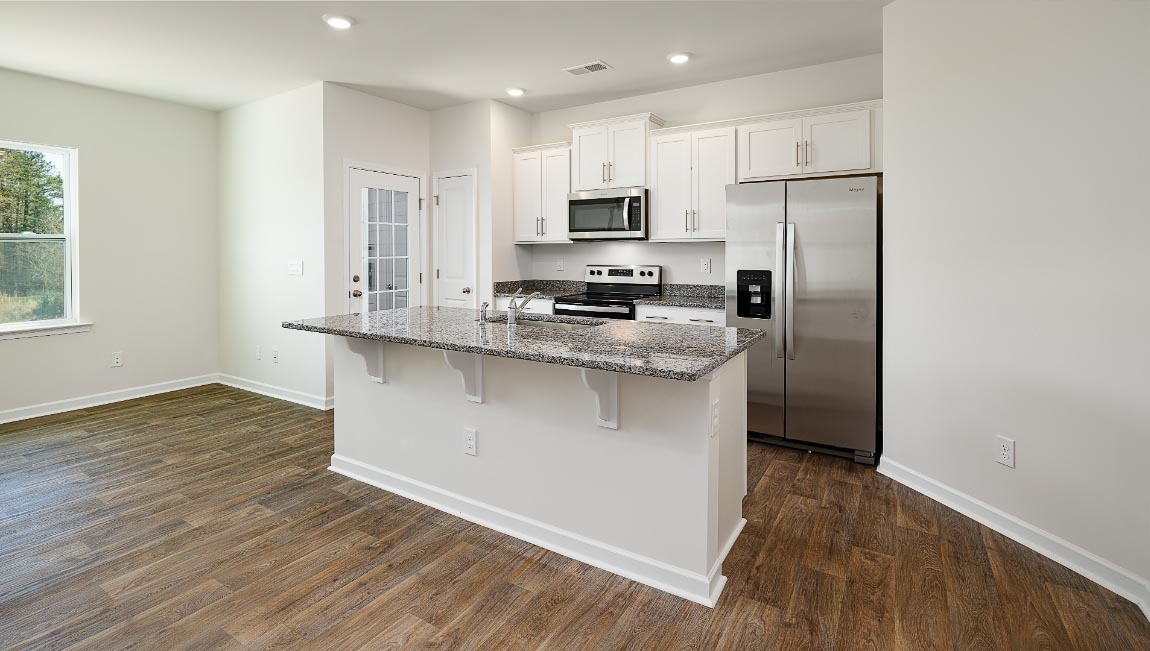 Open concept kitchen with stainless steel appliances and island