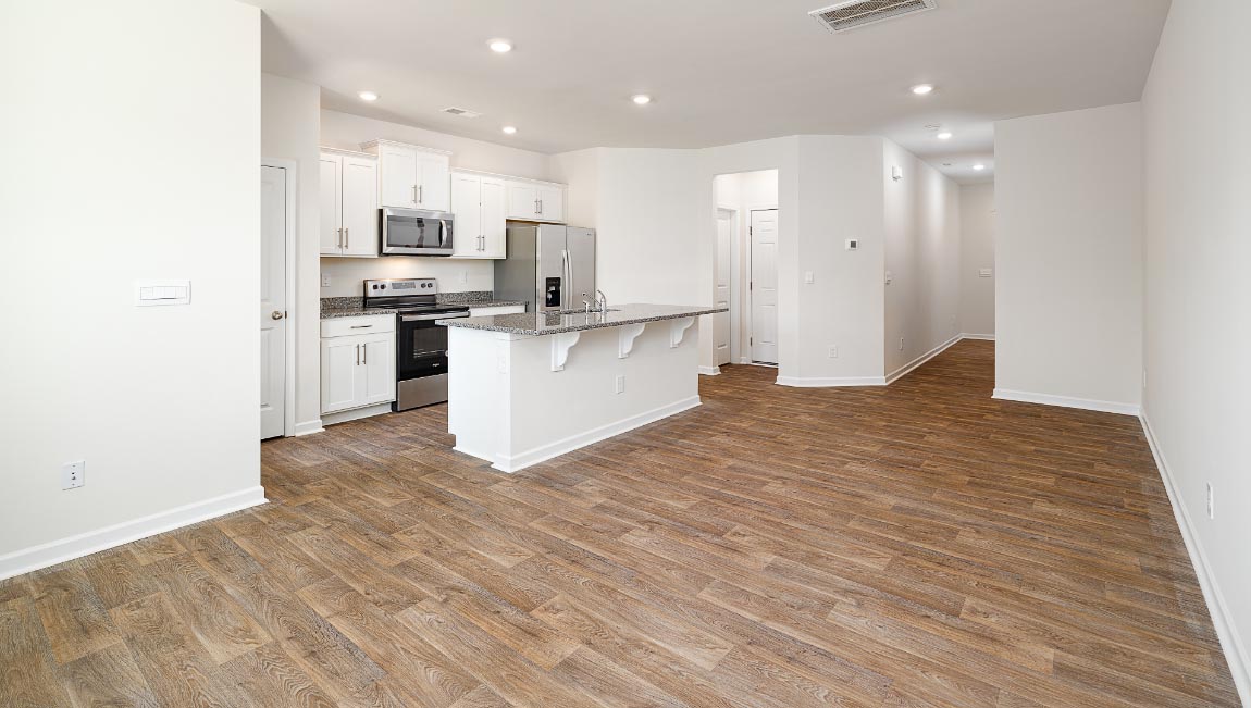 Open concept kitchen with stainless steel appliances and island