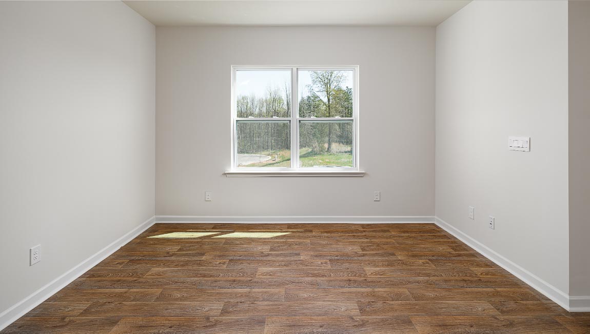 Family room with large window, beside kitchen