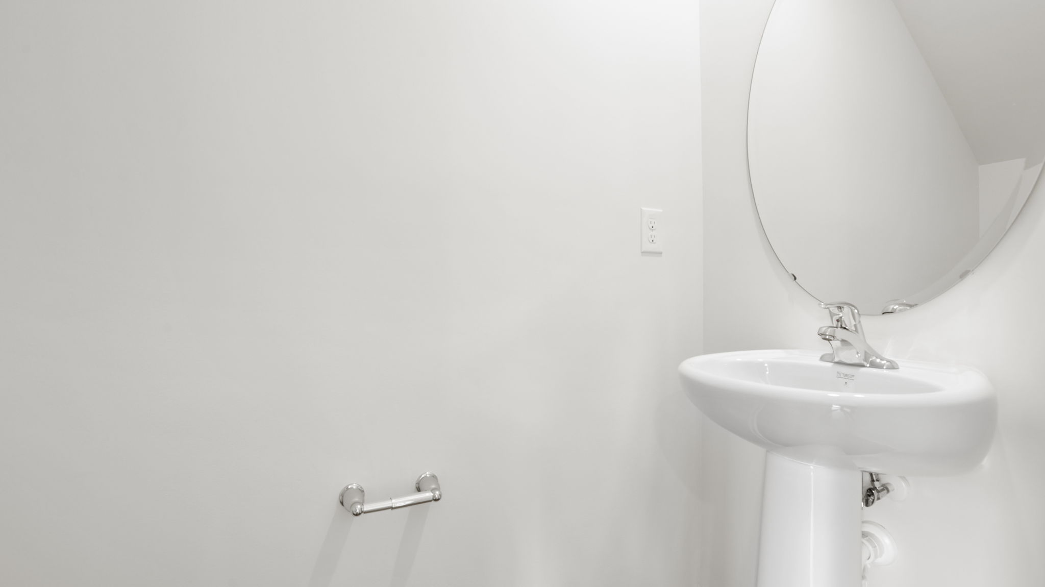 Half bathroom with single sink and mirror