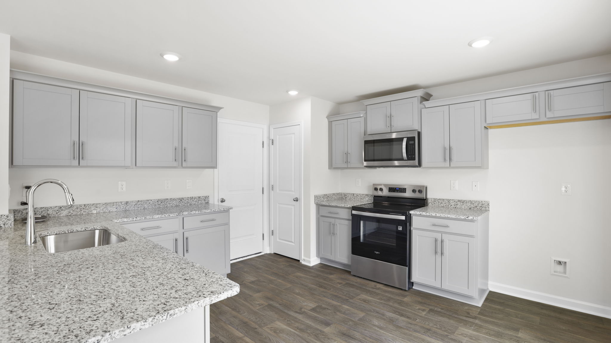 Open kitchen with stainless steel appliances