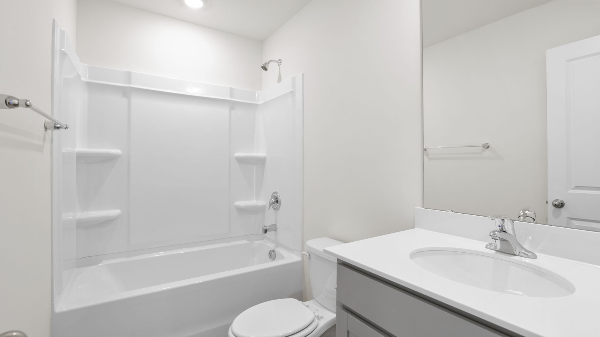 Bathroom with vanity and bathtub