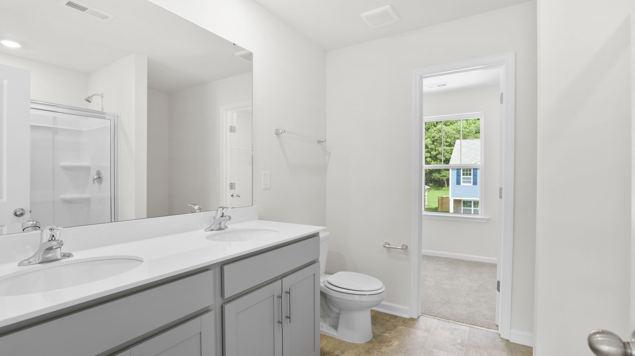 Primary bathroom with dual vanity