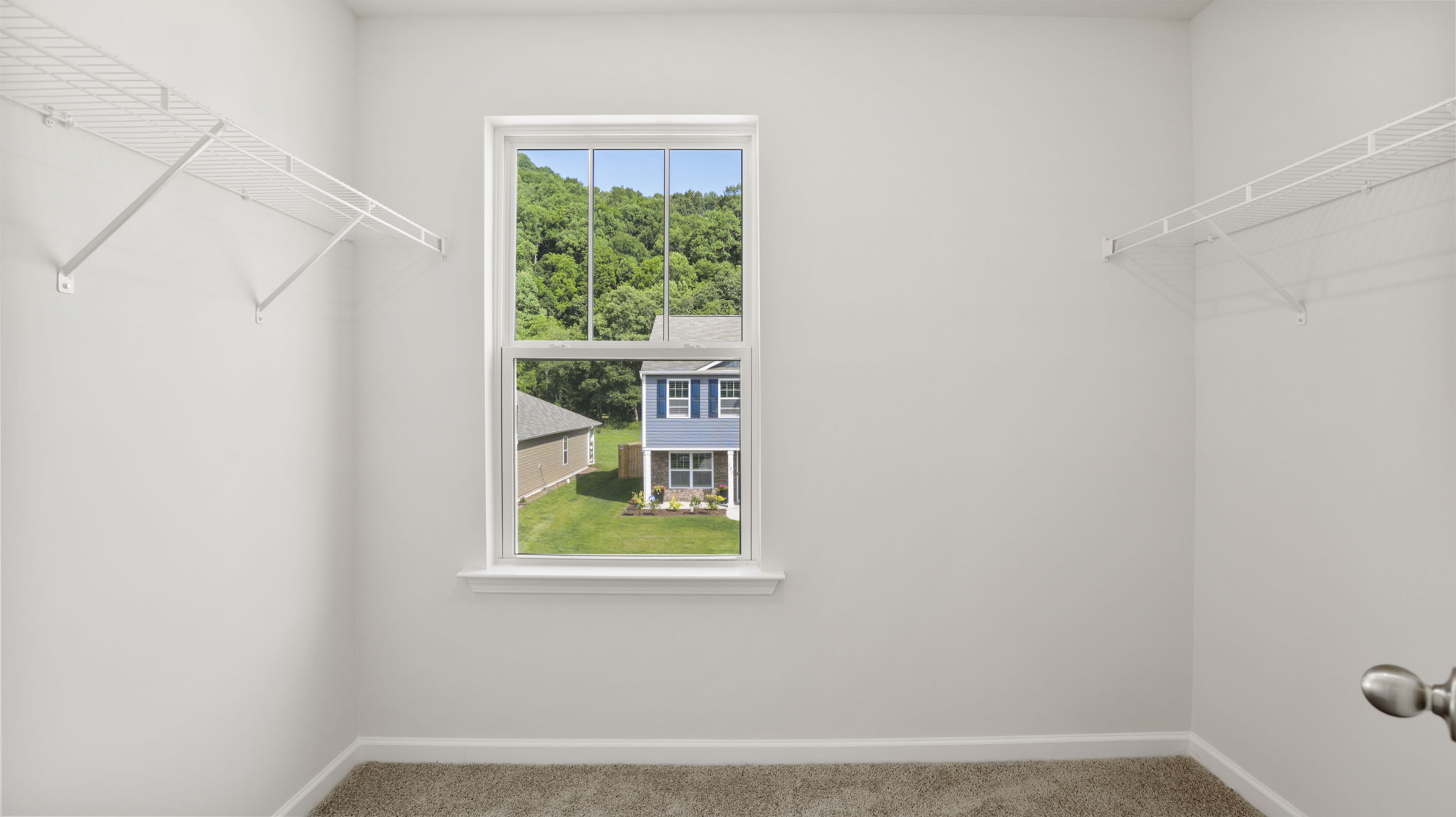 Primary walk in closet with window