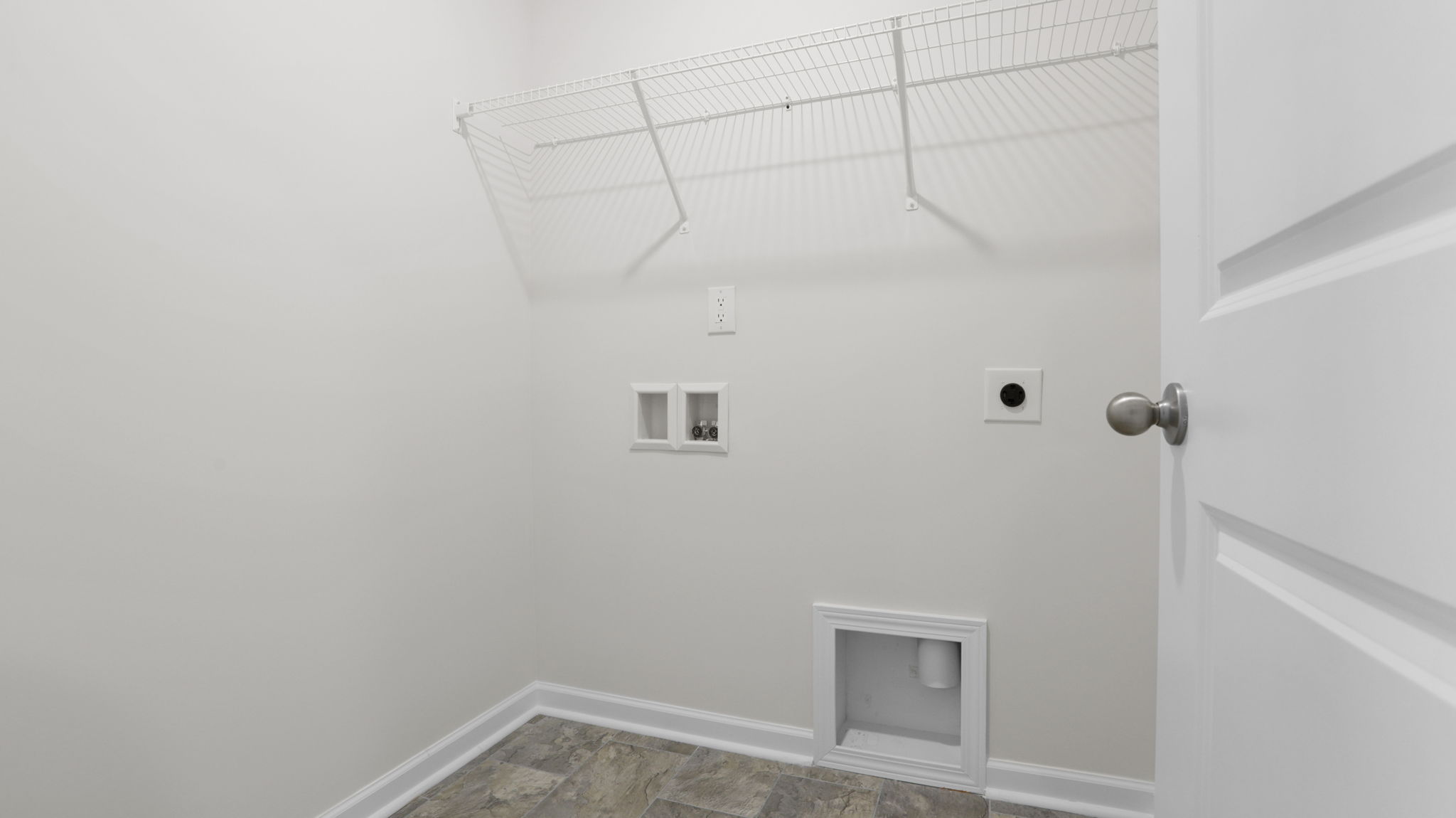 Laundry room with shelving