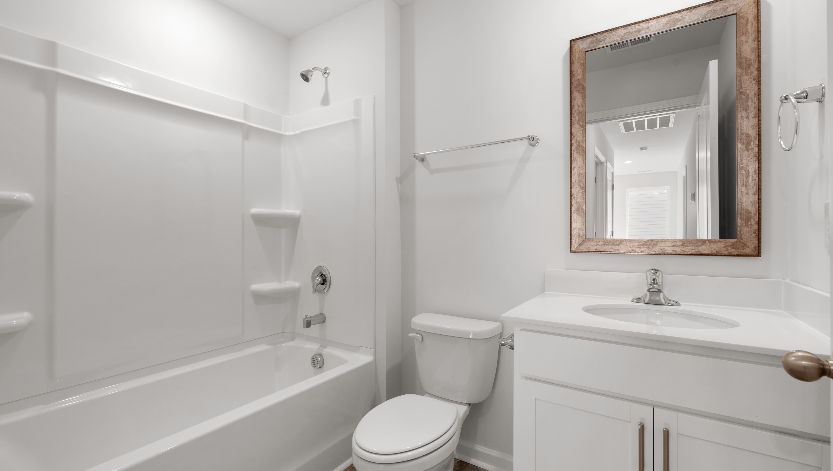 Bathroom with single vanity and bathtub