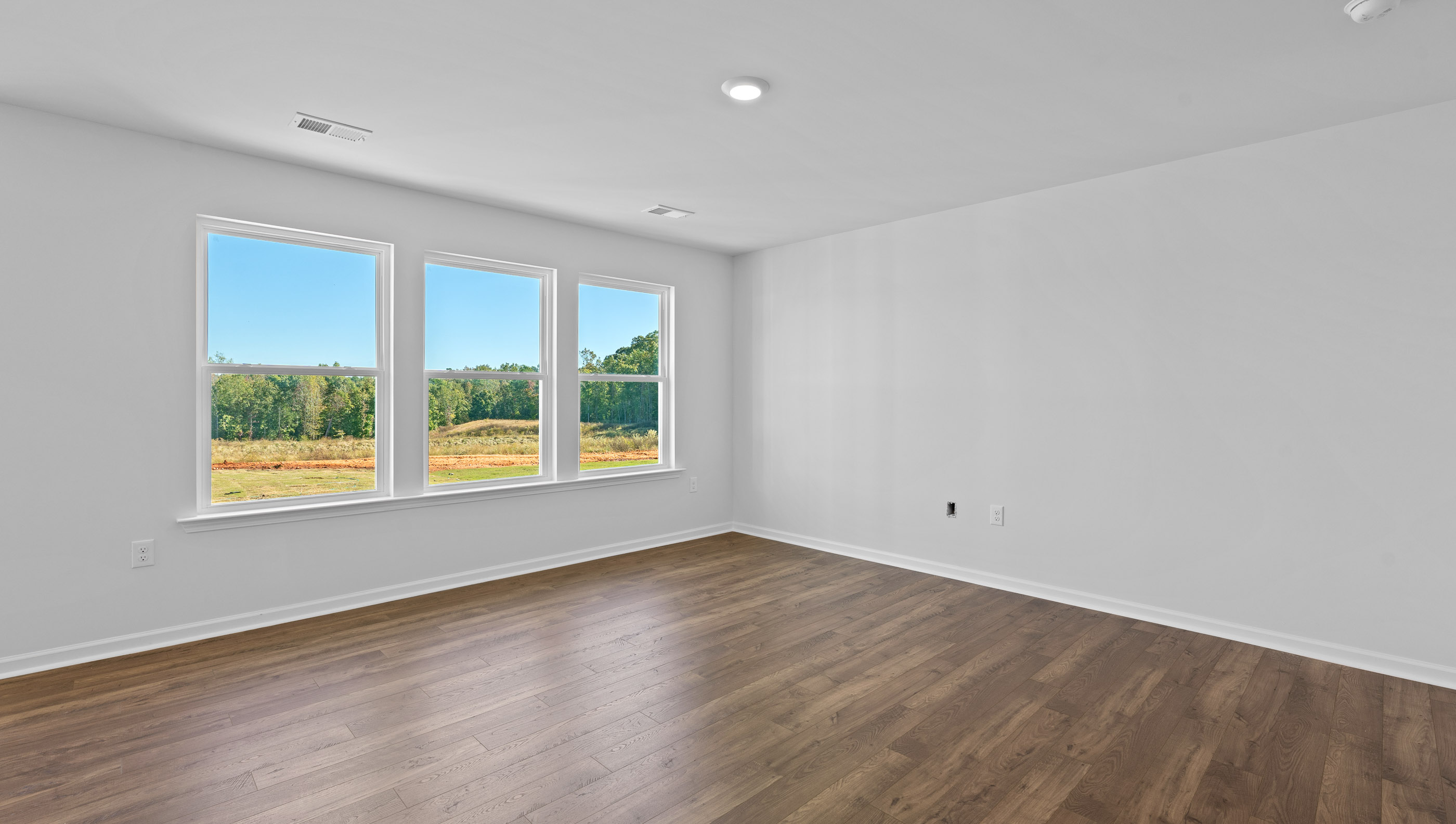 Open living space with multiple windows