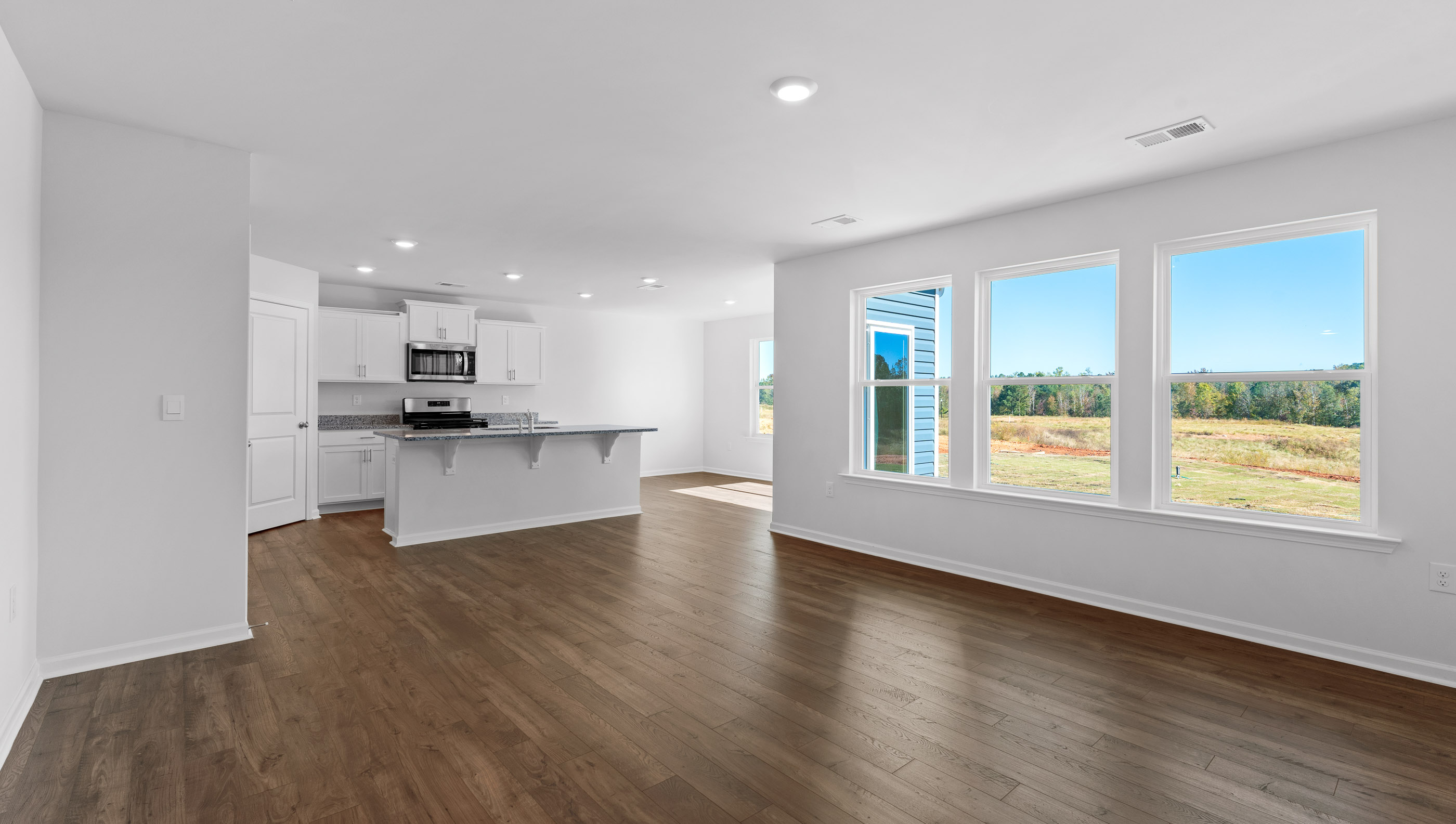 Open kitchen with stainless-steel appliances and island