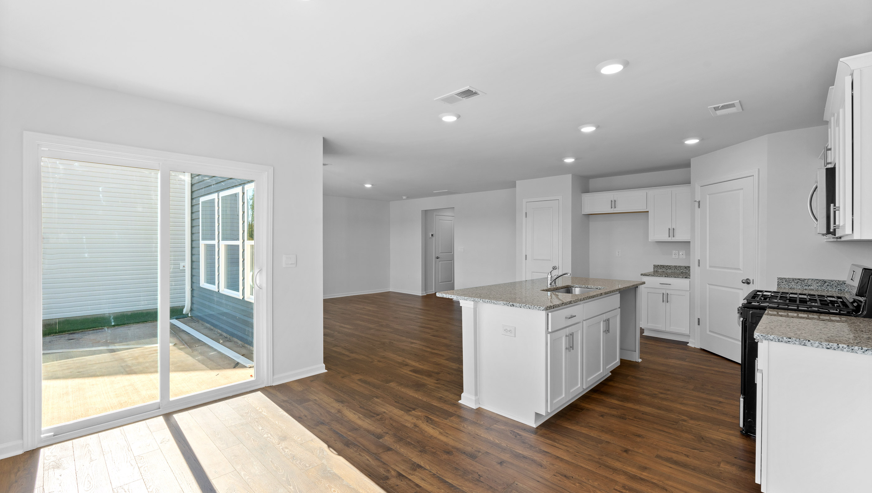 Open kitchen with stainless-steel appliances and island