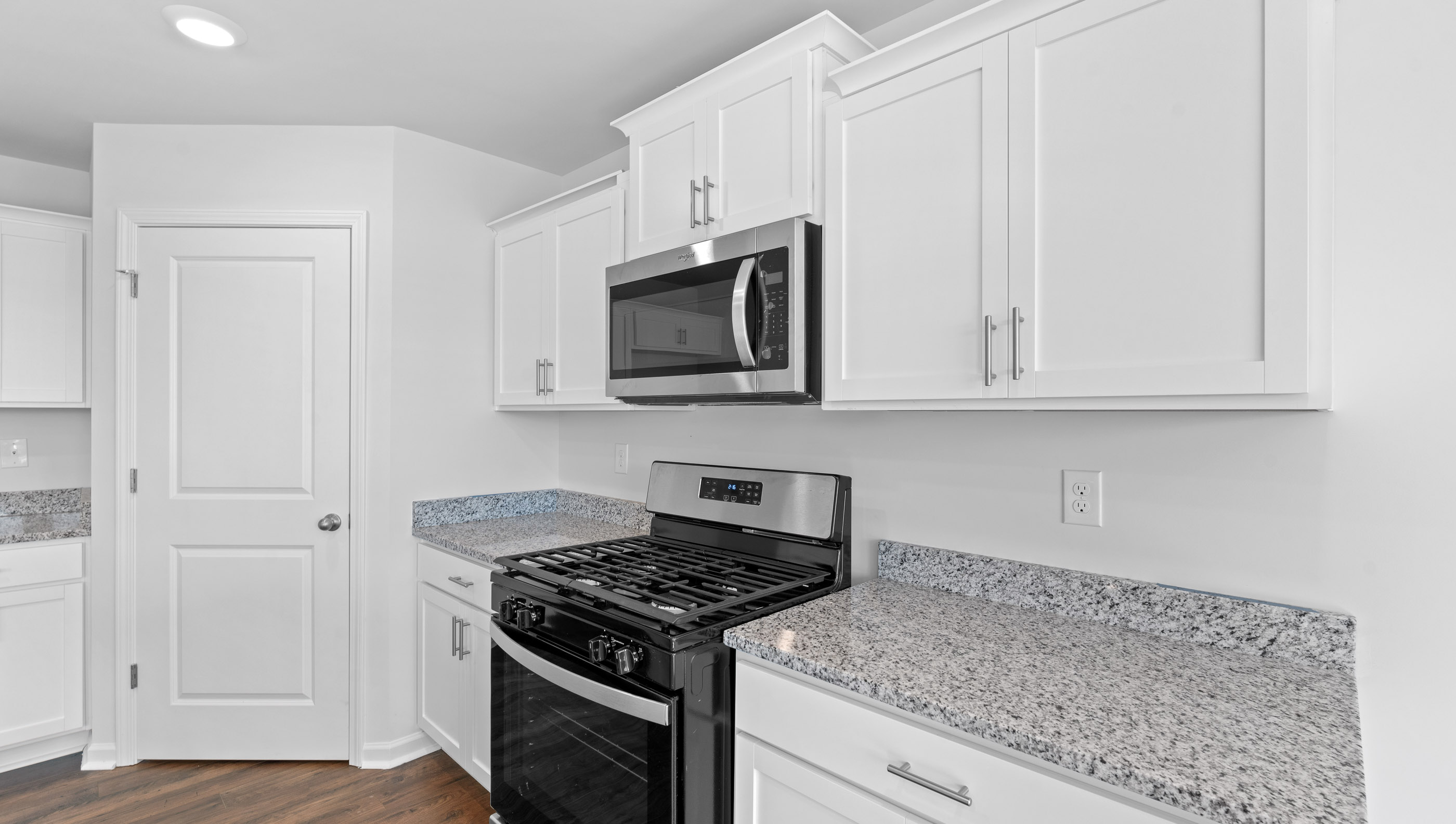 Open kitchen with stainless-steel appliances and island