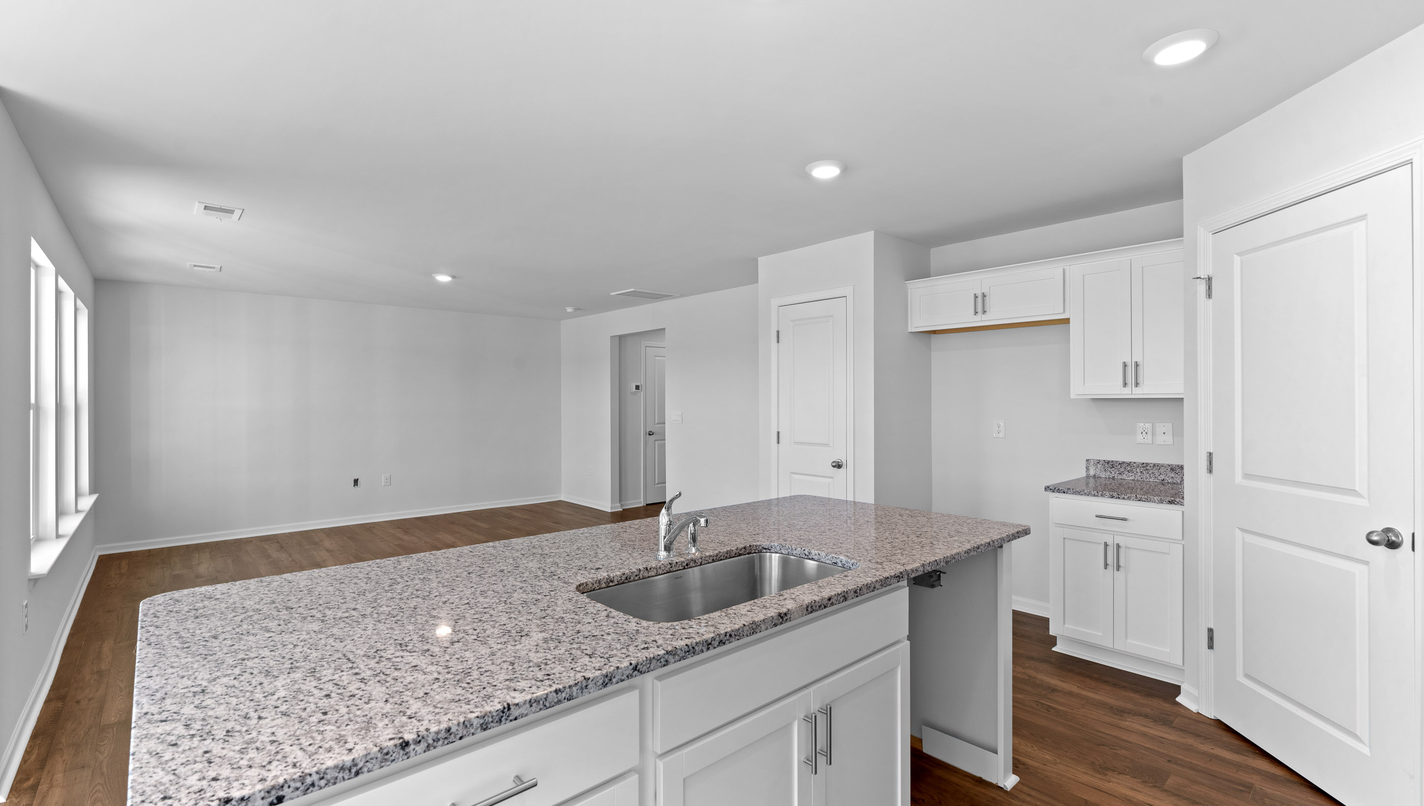 Open kitchen with stainless-steel appliances and island