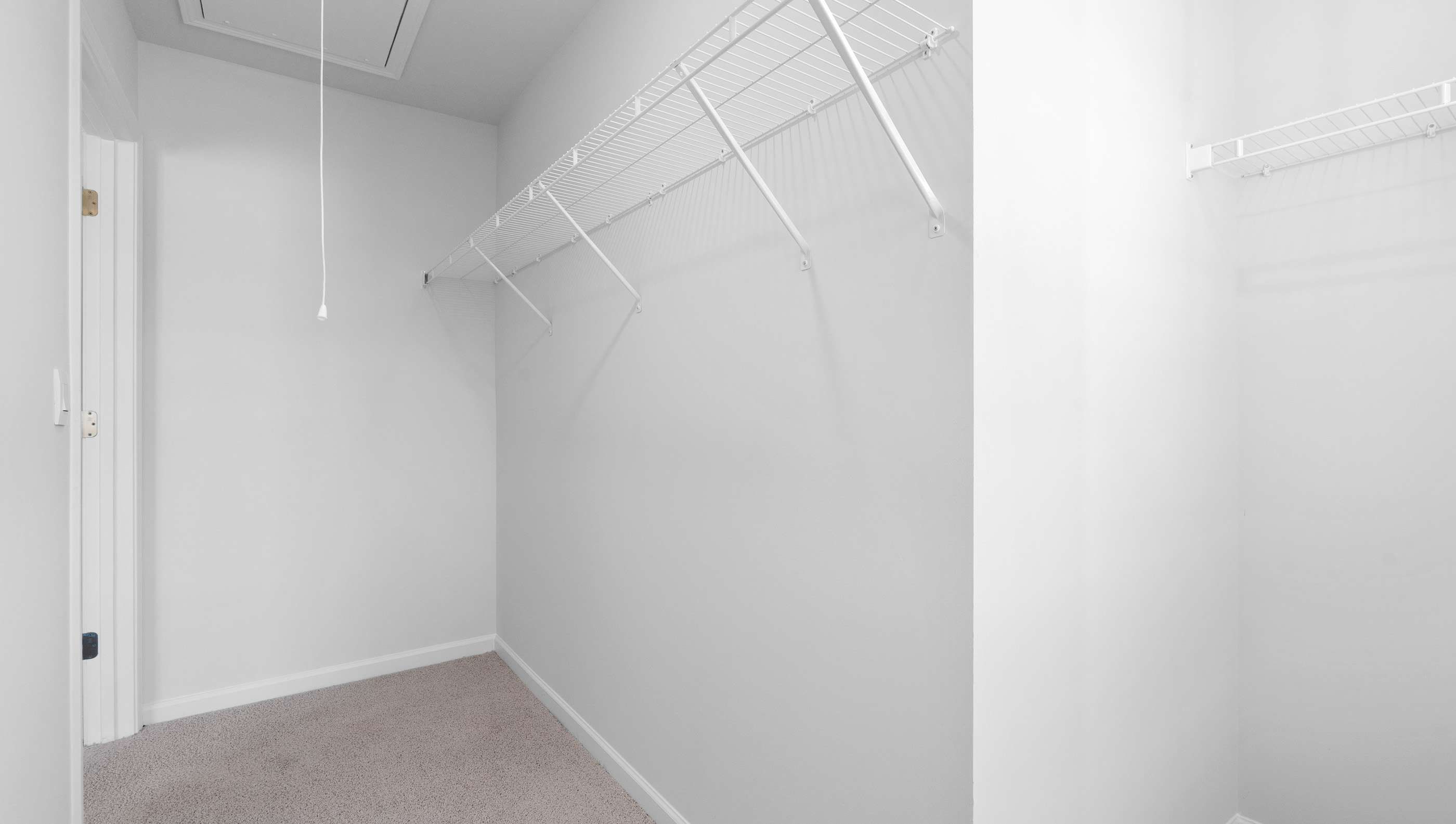 Walk in closet with shelving
