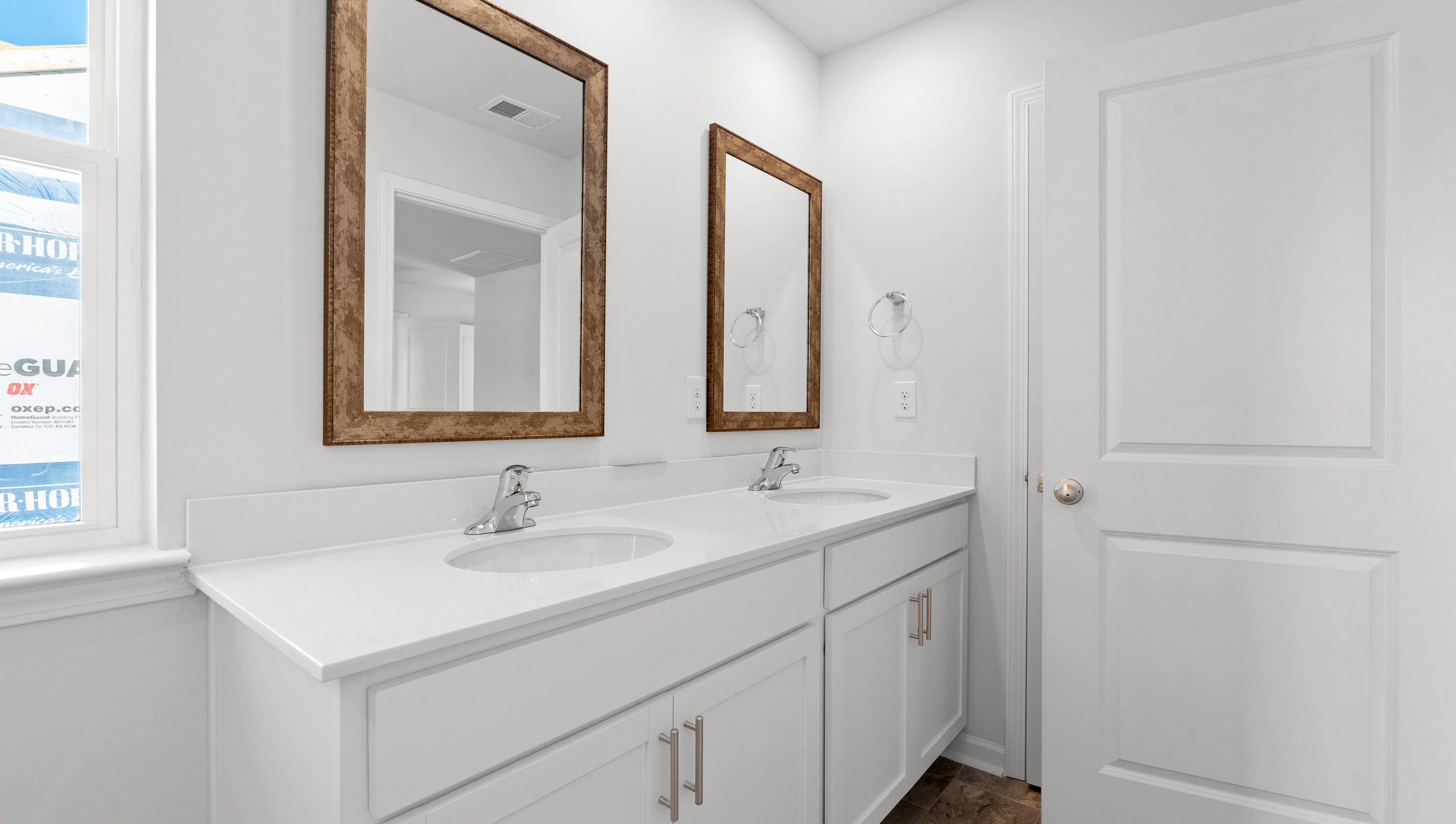 Bathroom with dual vanity and shower