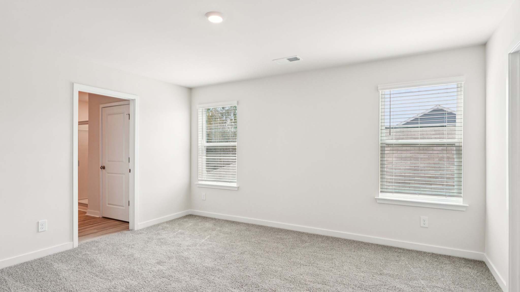 Primary bedroom with large window