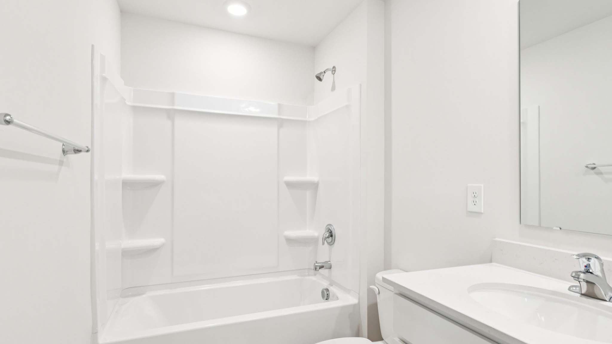 Bathroom with double vanity and tub